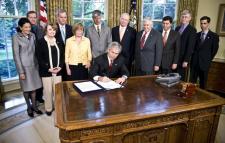 President Bush signs GINA.<br>White House photo by Eric Draper.