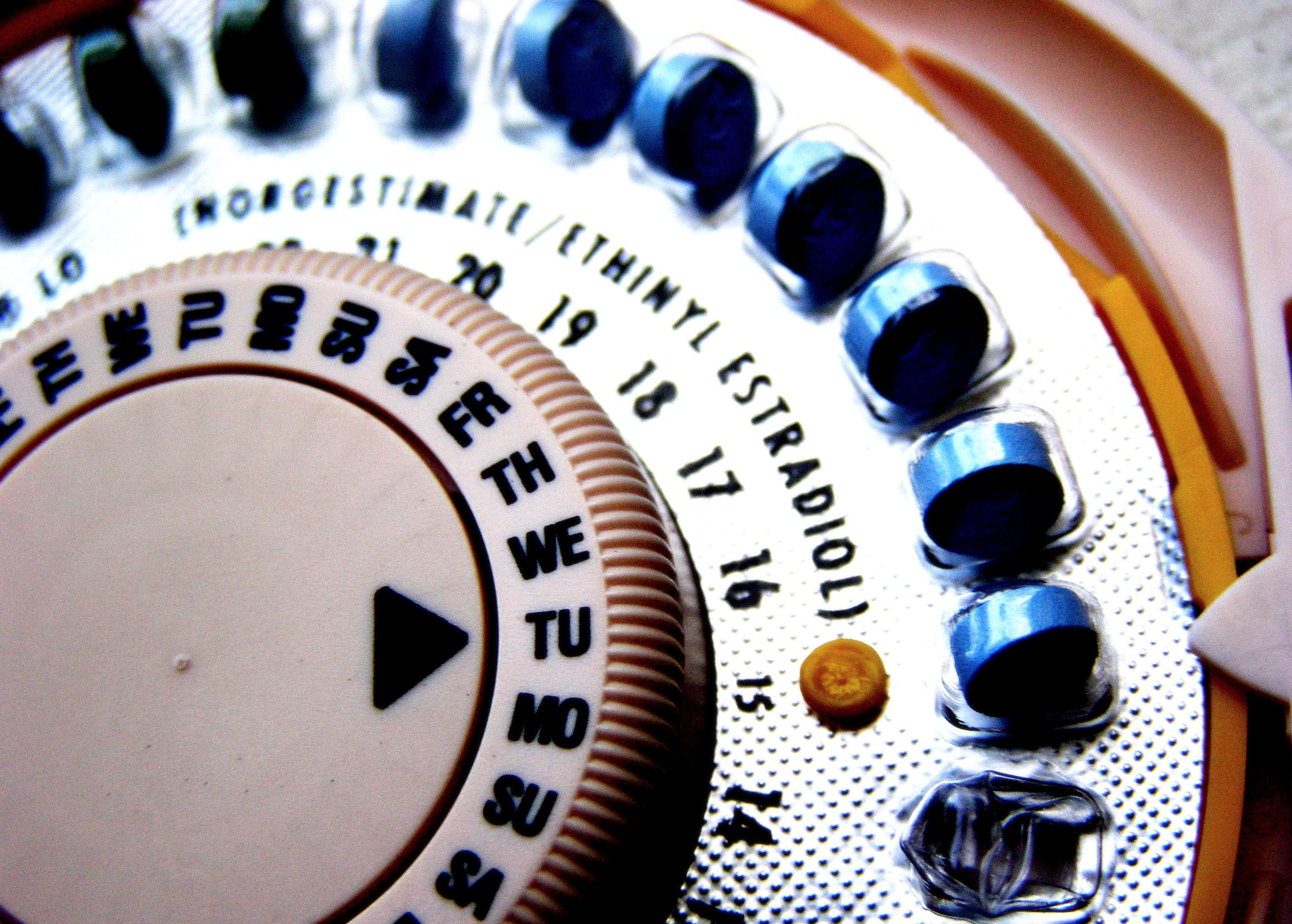 Circular dial containing birth control pills.