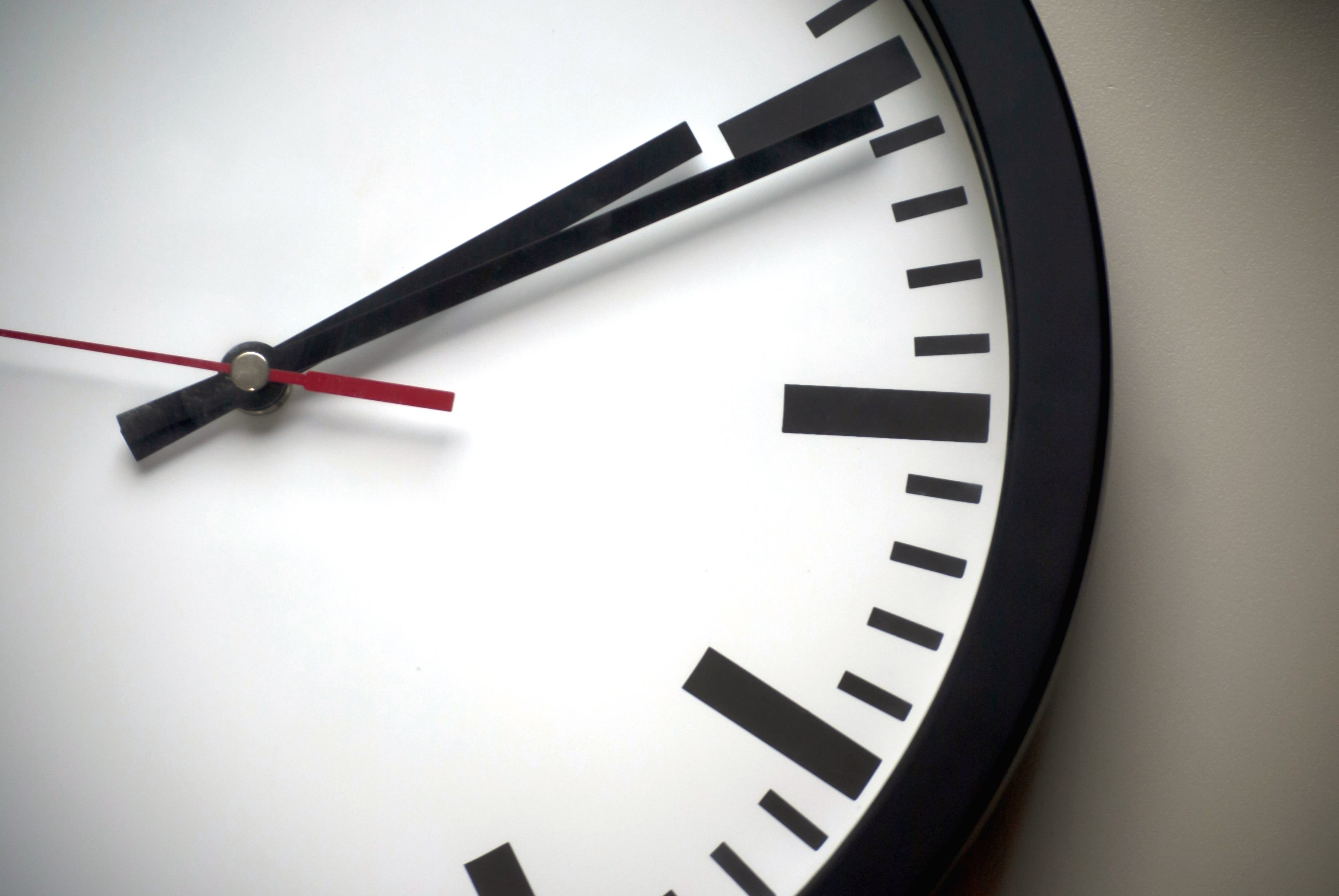 Close up photo of a hand clock.