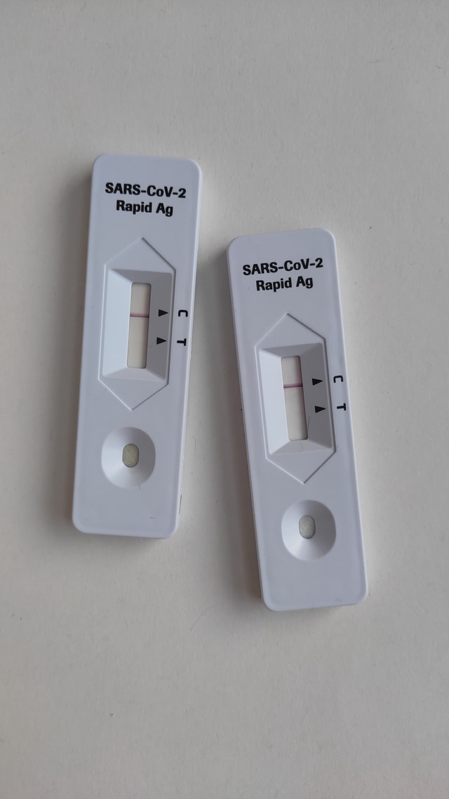 two white cartridges for covid antigen testing