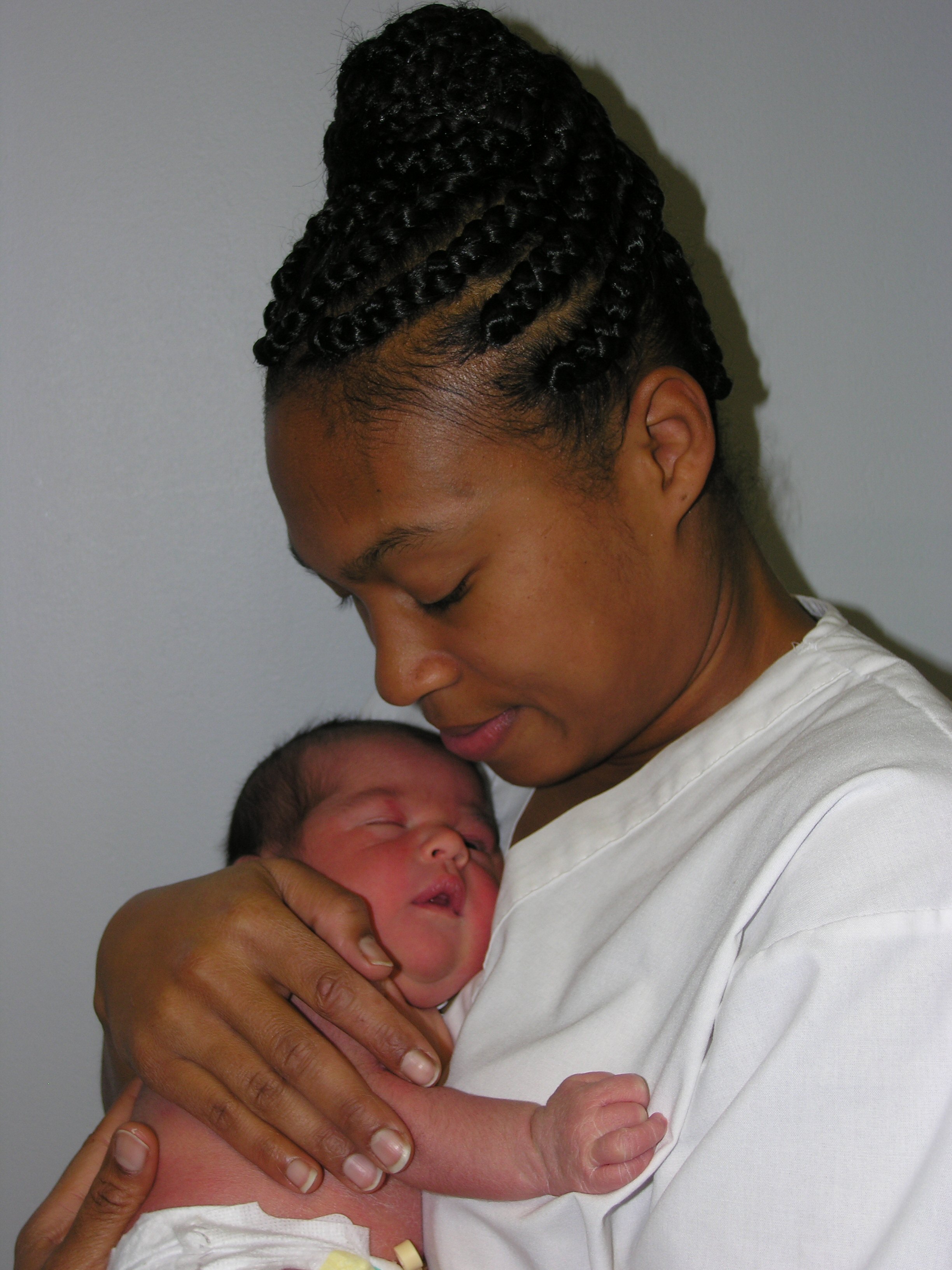 a black mother holding her baby