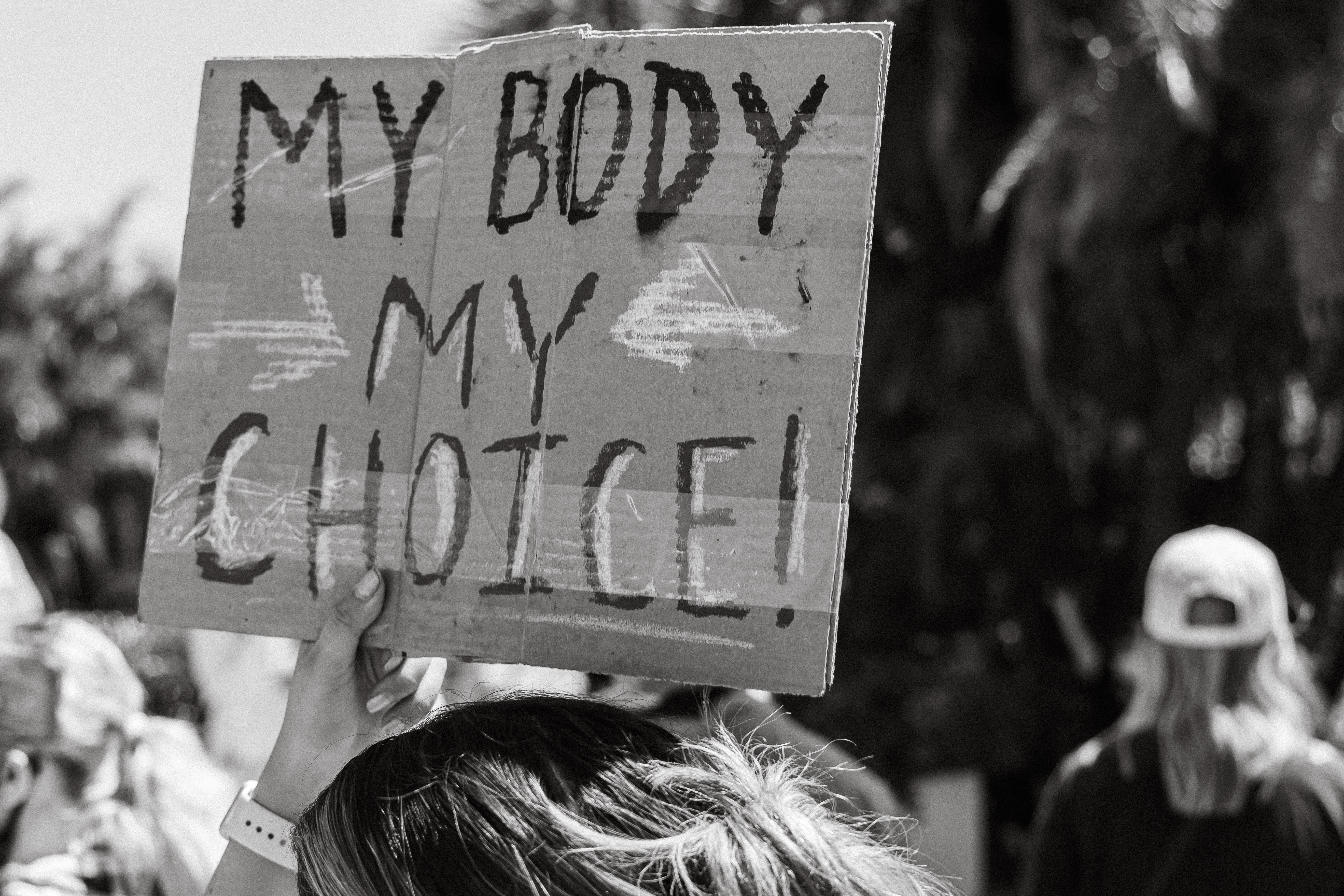 Image of a protest sign with the words "my body my choice"