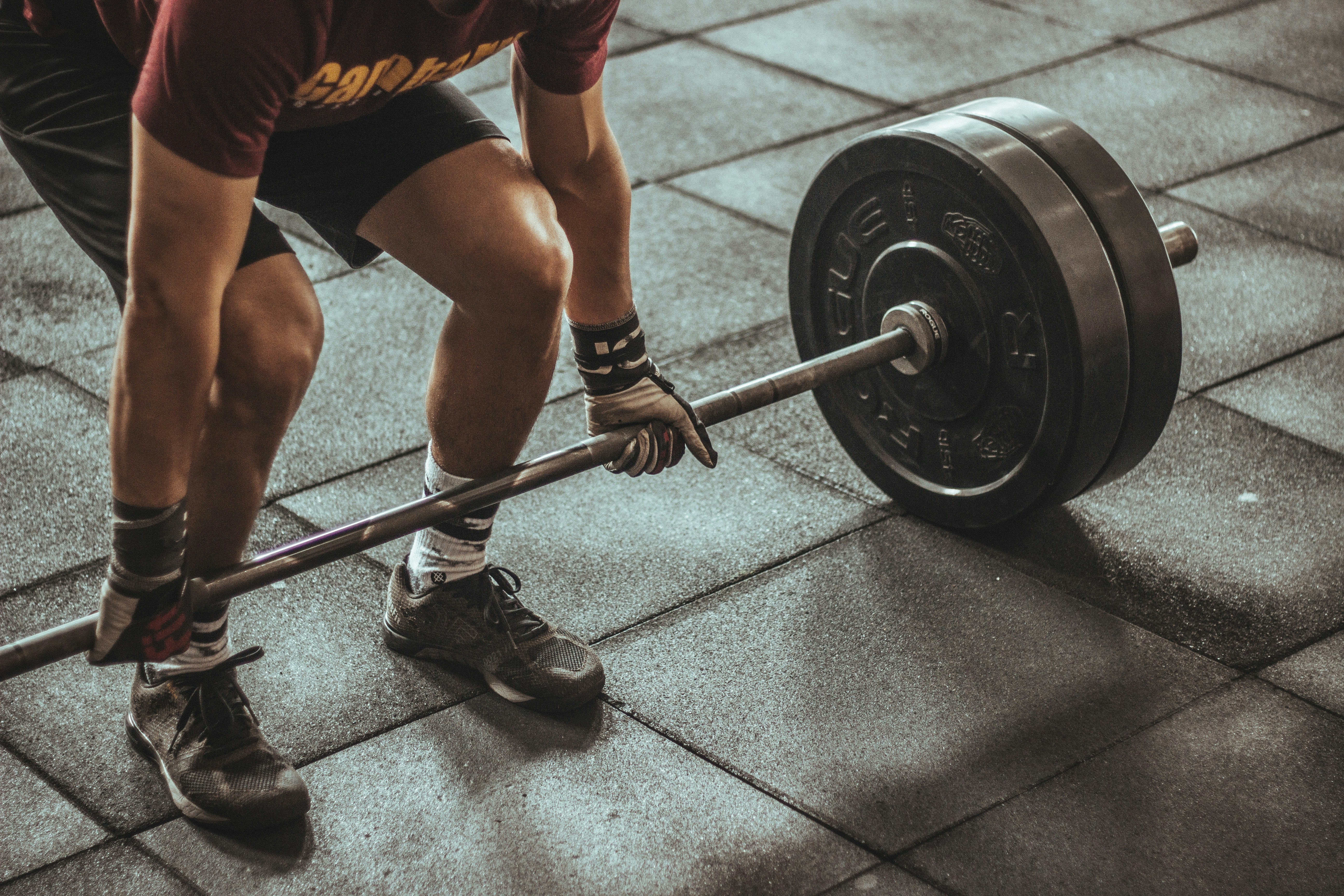 a person lifting a barbell