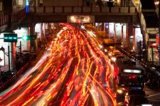 Picture capturing moving traffic on a busy night.