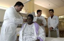 Doctor examining a black patient