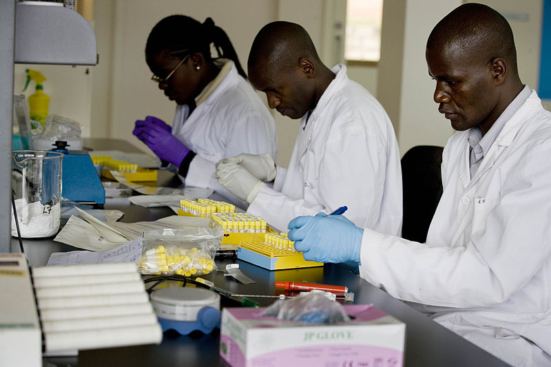 Three African scientists working in a lab