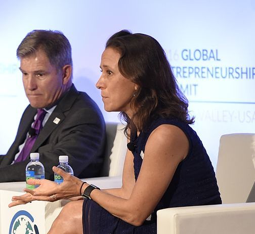 Anne Wojcicki appears engaged as a speaker on a panel.