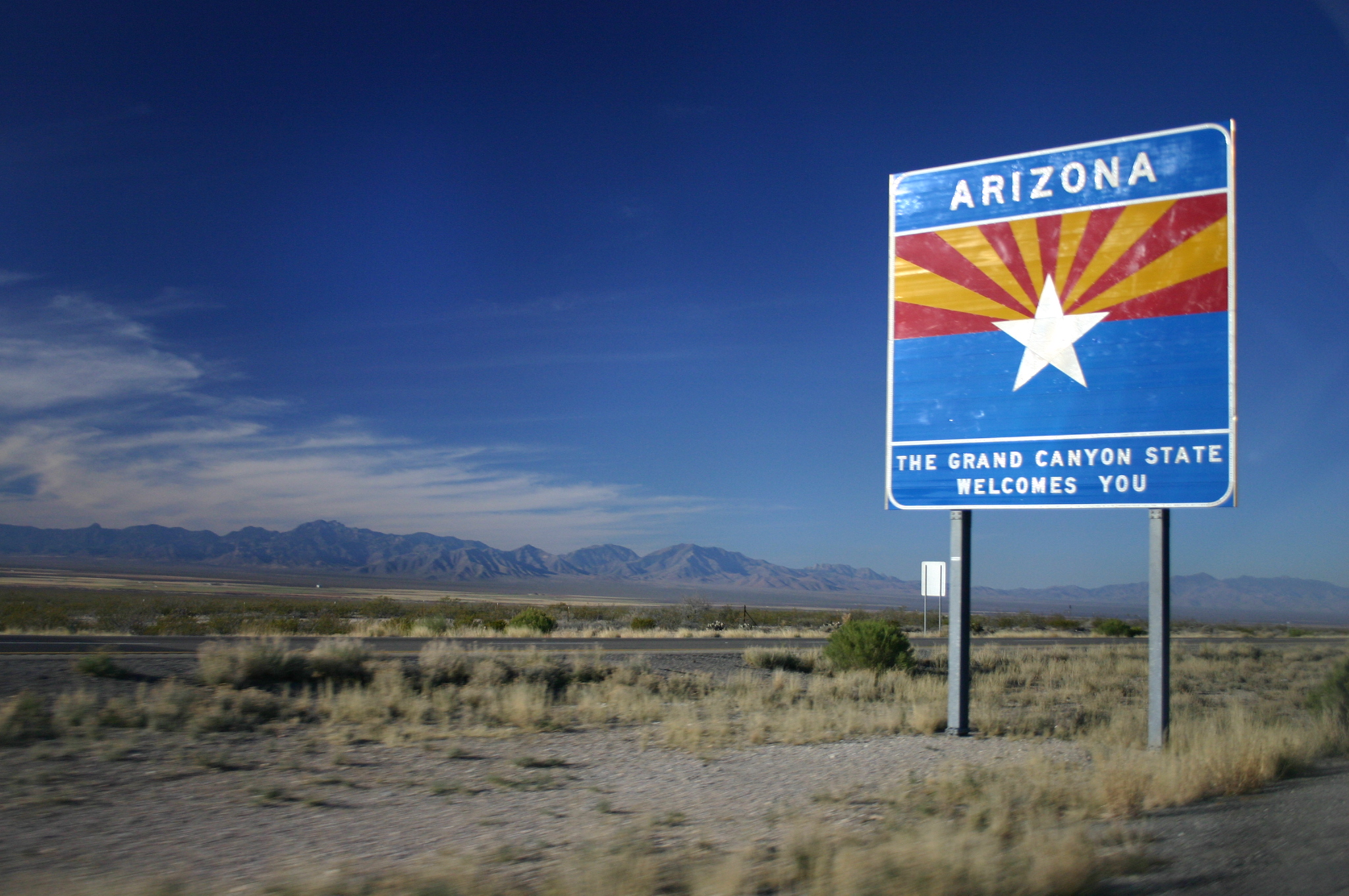 Sign says, "Arizona: The Grand Canyon State welcomes you"