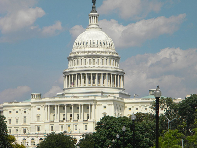 The U.S. Capitol building with a cloudy sky