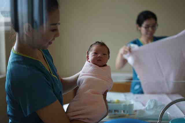 Chinese baby with nurse