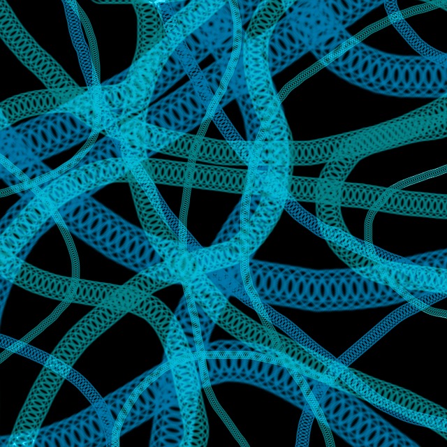 Abstract design of several double helices crossing over each other against a black background.