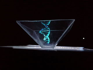 Spotlight in which a DNA model is projected as a hologram inside of a transparent, square glass bowl.