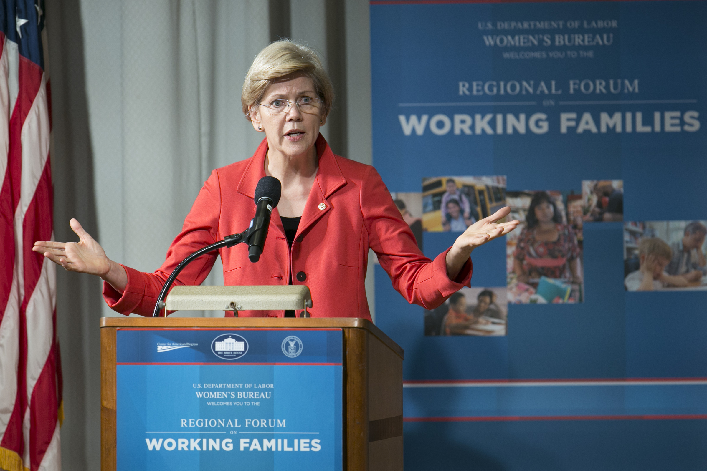 Elizabeth Warren speaking at a podium