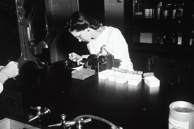 Female scientist in black and white
