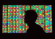 human silhouette with genome backdrop