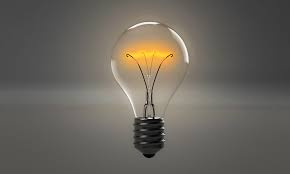 Image of a lit clear light bulb 