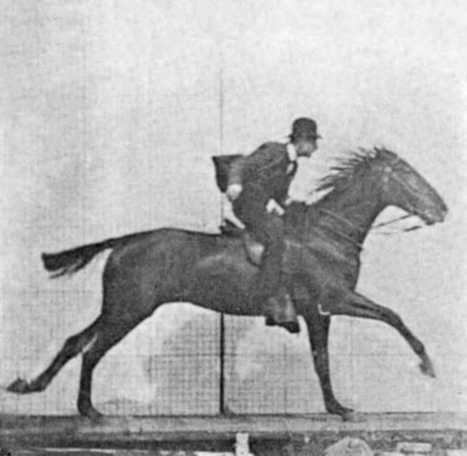 Animated black and white photo of a man on top of a galloping horse.