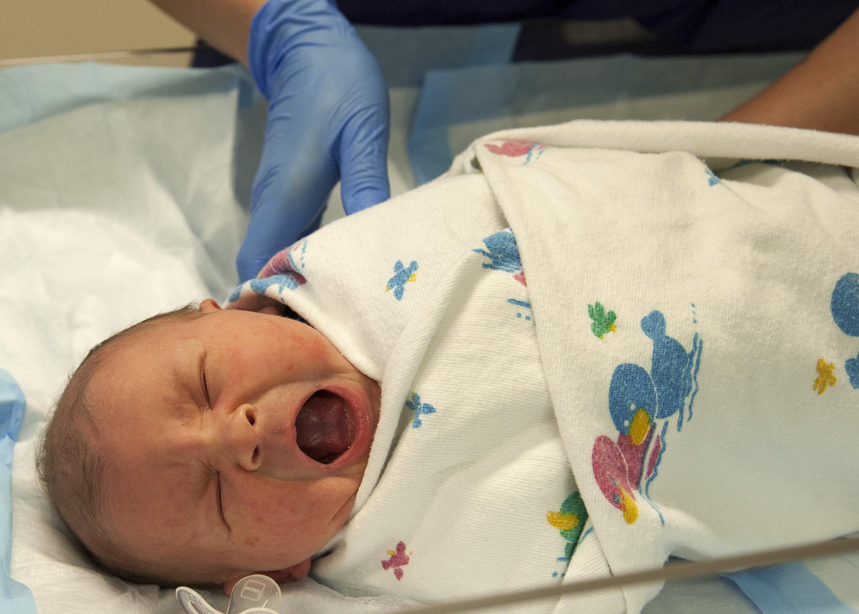 Newborn baby crying in hospital