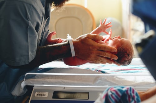 a newborn being laid down