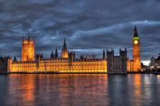 Landscape photo of Parliament's building, with a waterfront.