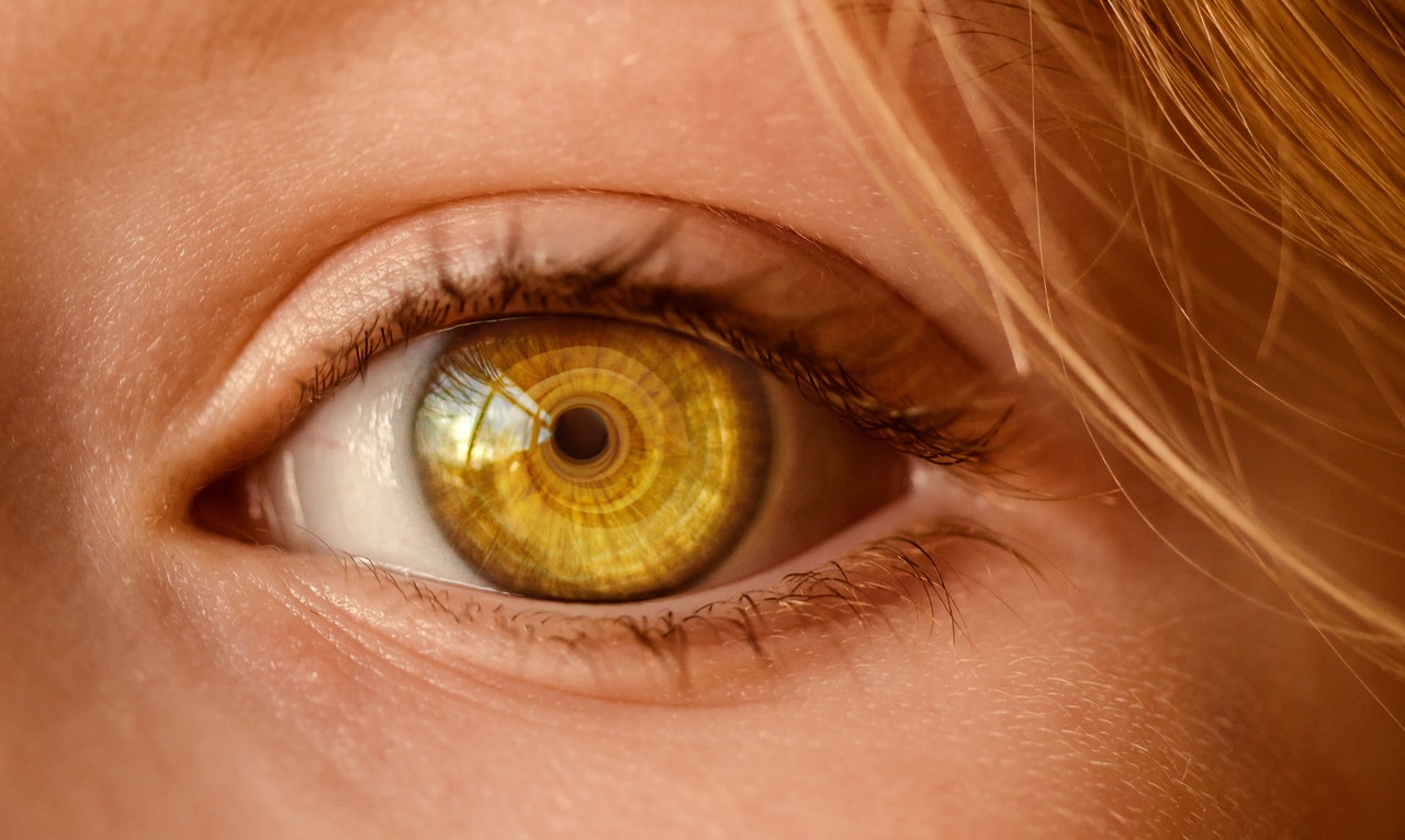 Close-up of a caucasian woman's eye, looking directly at camera.