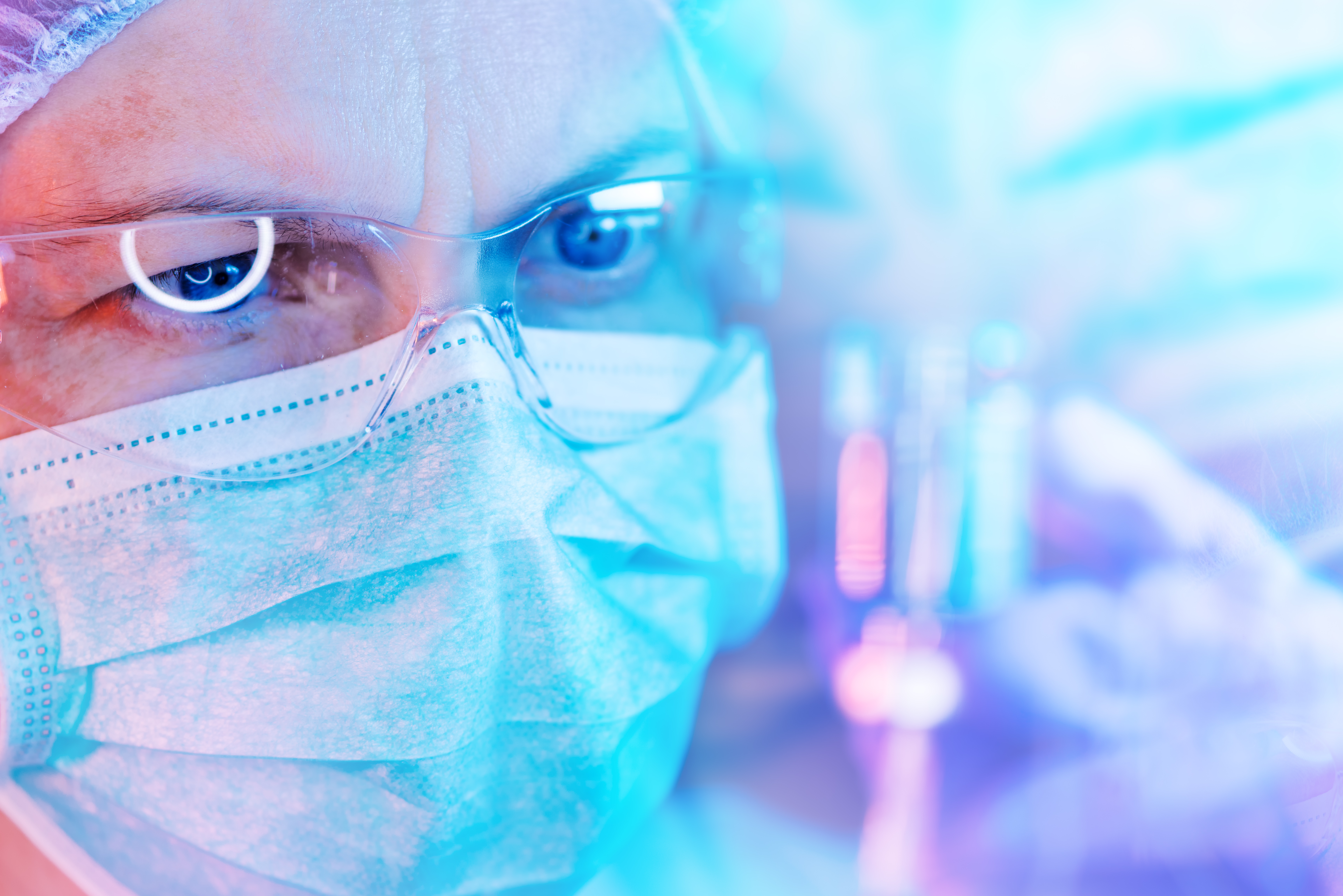 close-up photo of a researcher wearing safety glasses