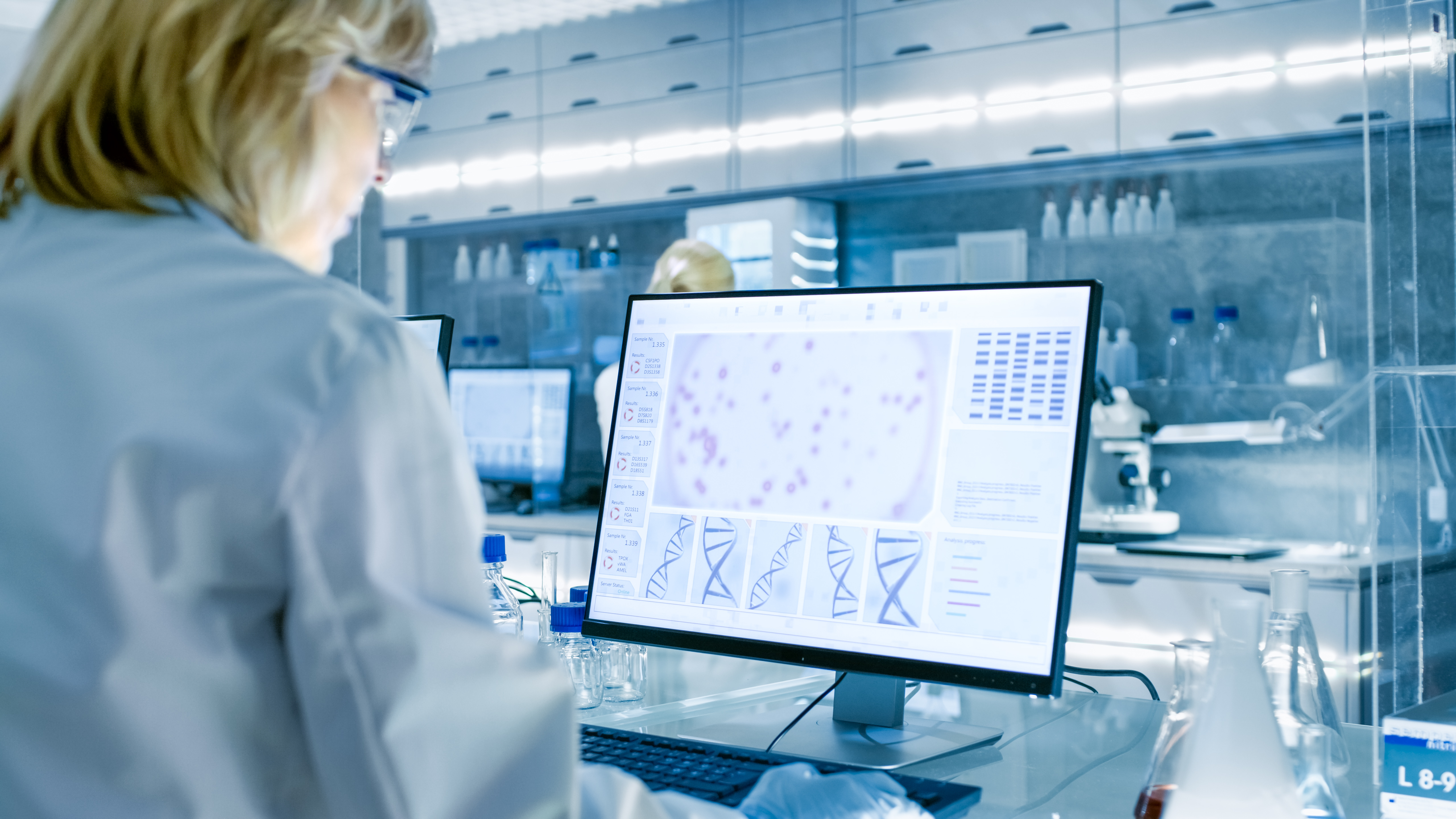 scientist looking at a computer monitor