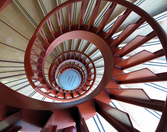 A bird's eye view of a spiraling staircase cascading downward.