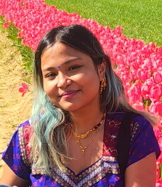 ananya in a field of tulips