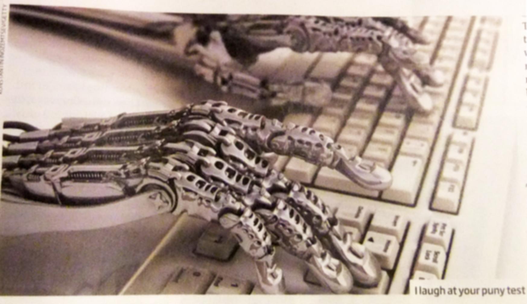 Robotic hands are typing on a computer's keyboard.