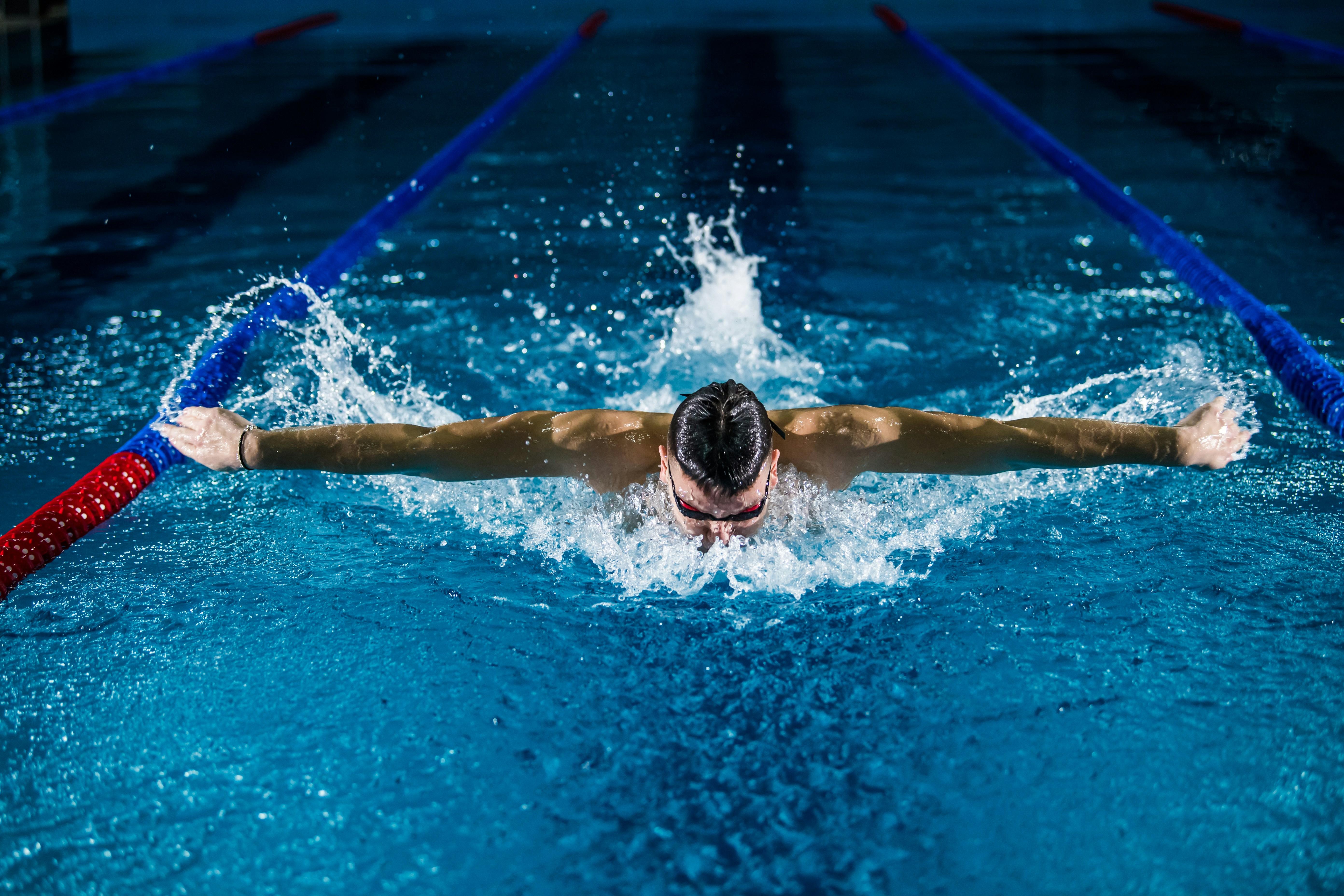 a person swimming in a pool 