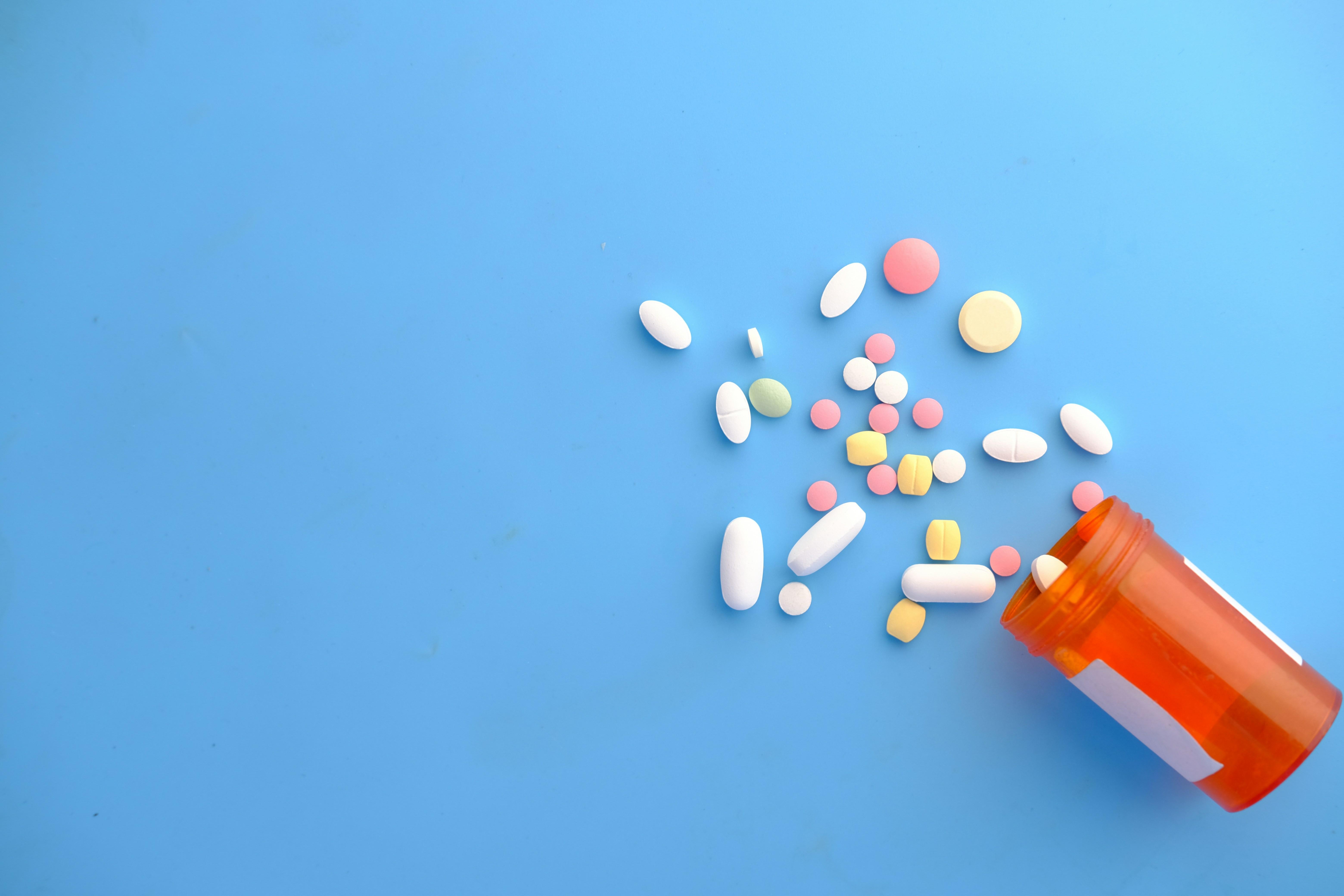prescription pills on blue background