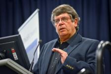 Portrait photo of Alan Trounson speaking