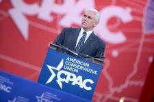 Mike Pence speaks in front of podium, with CPAC American Conservative Union banner.