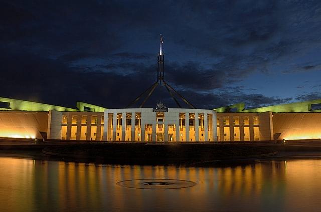 Exterior of Parliament House in Canberra, Australia lit up at night
