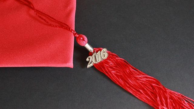 Bird's eye view of a red graduation cap, with a 2016 tassel attached.