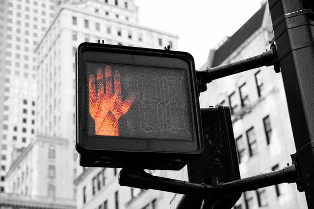 Crossing signal light displays red hand