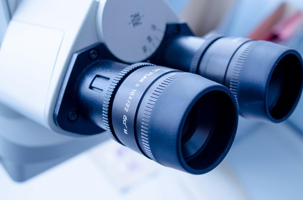 A close up on the viewing end of a lab microscope.