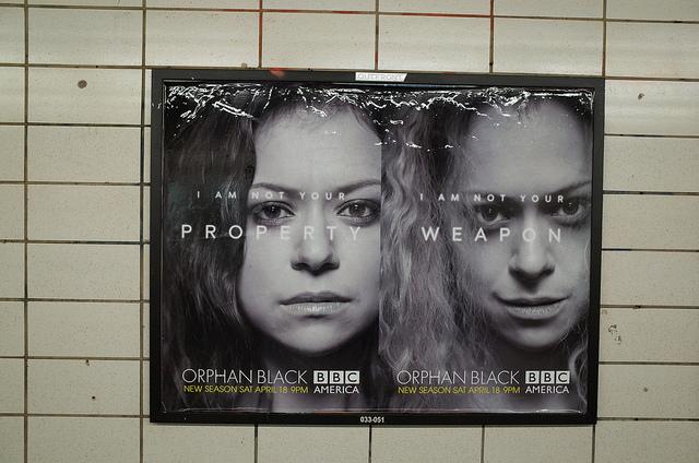An Orphan Black promotional poster, featuring two side by side portraits of a woman, with the headline "I am not your property" and "I am not your weapon."