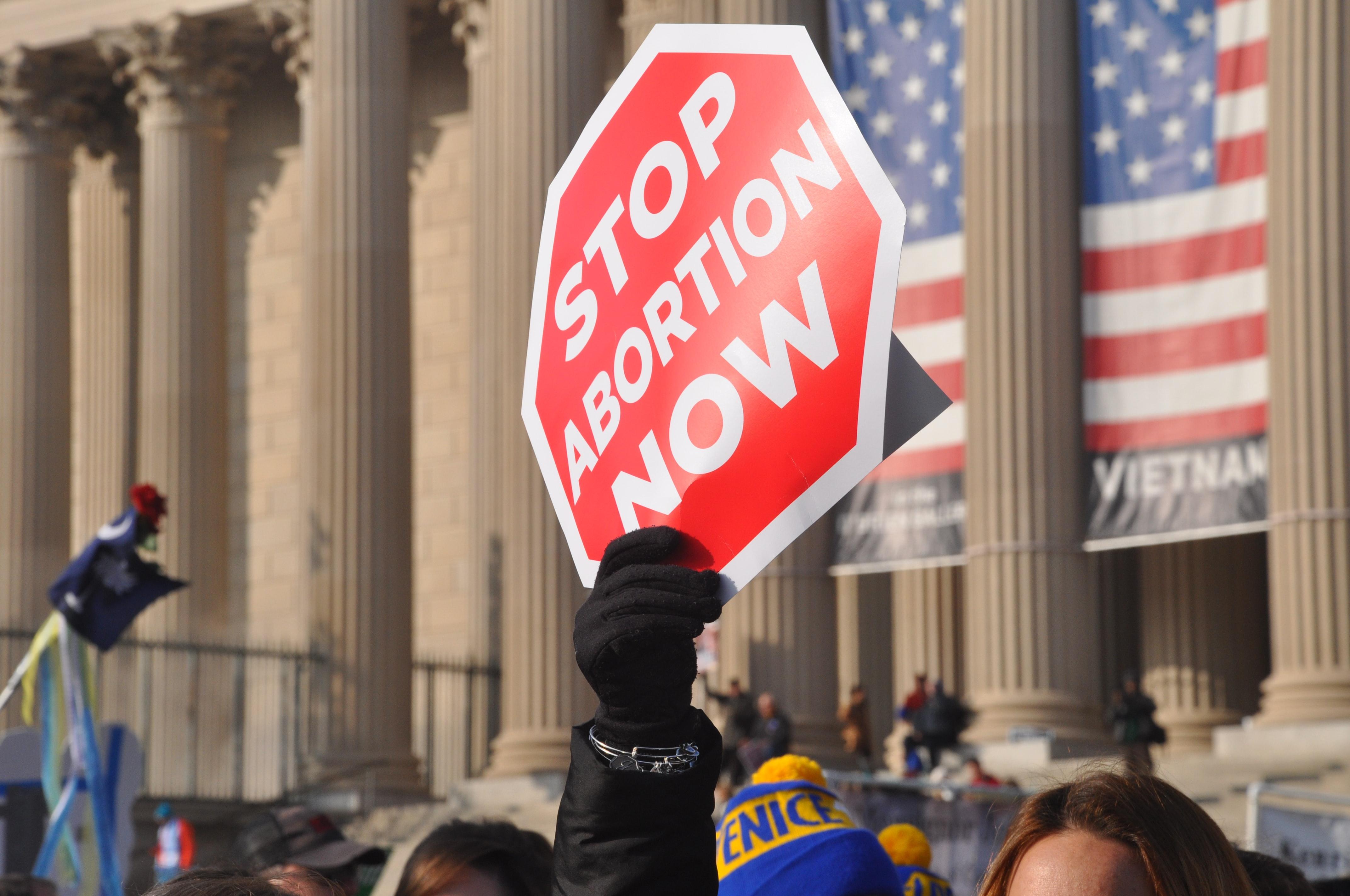 a stop abortion now sign