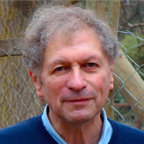 image of a white man with curly grey hair