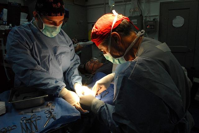 2 doctors performing surgery