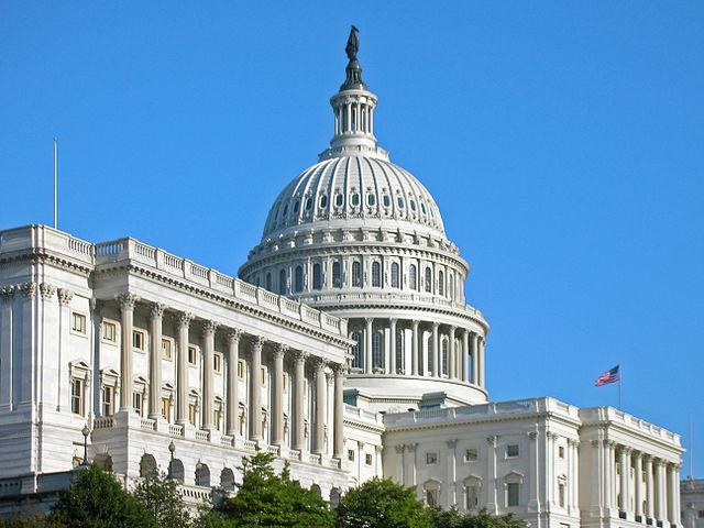 Image of the front of the US Capitol building taken from a diagonal angle. 