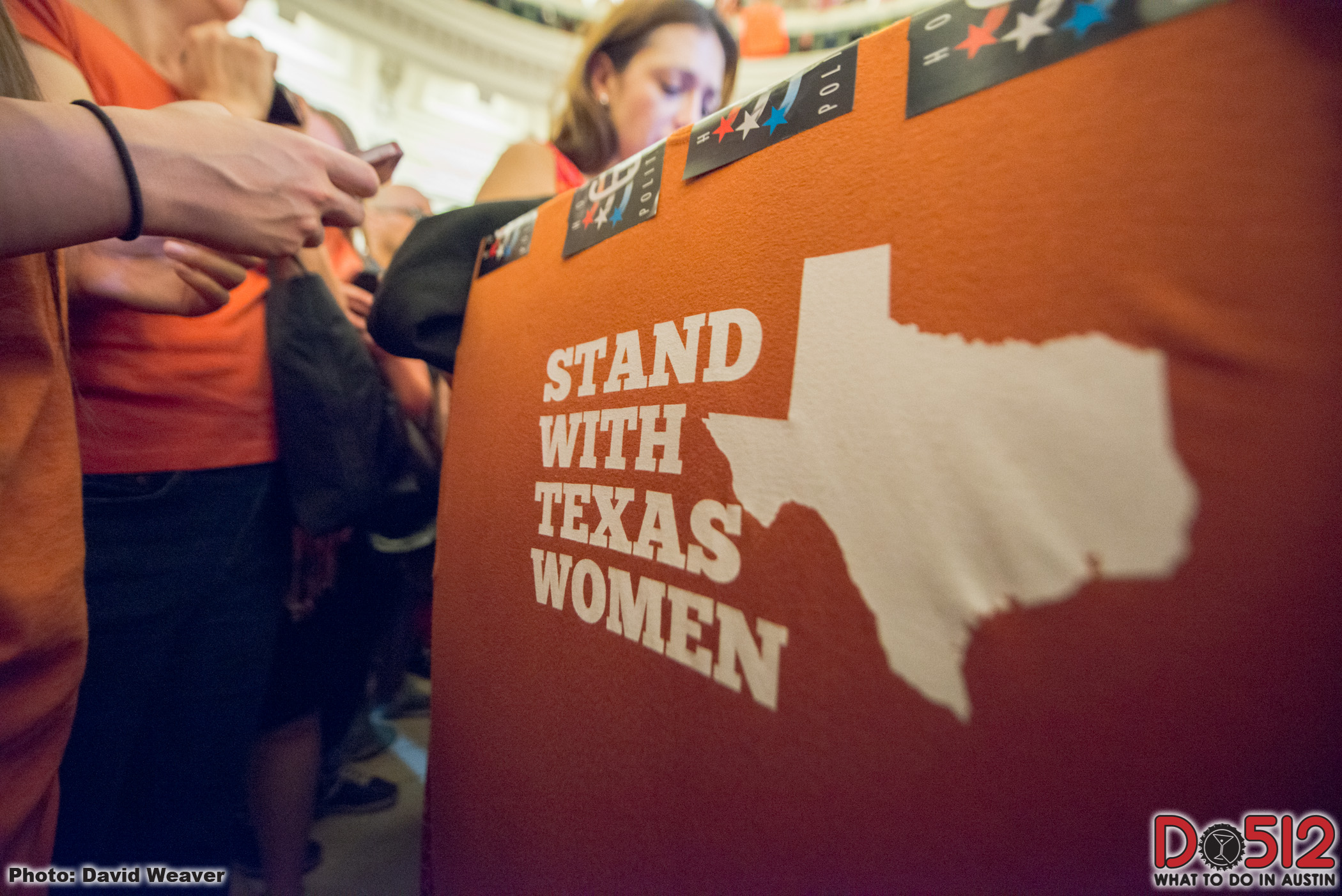 Orange sign that reads "STAND WITH TEXAS WOMEN"