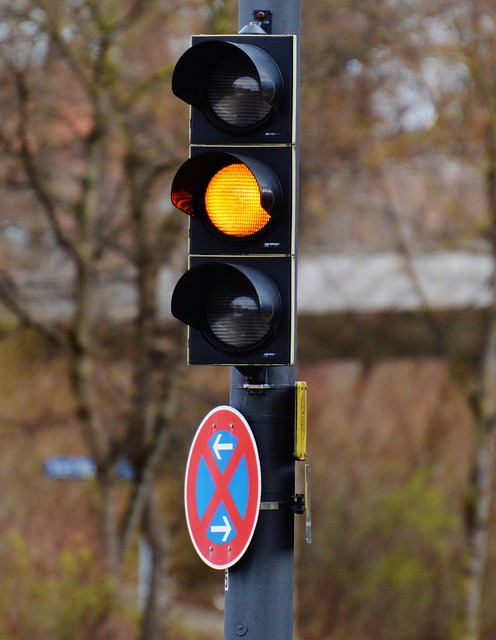 A traffic light appears yellow to signify caution (rather than a green go, and a red stop)