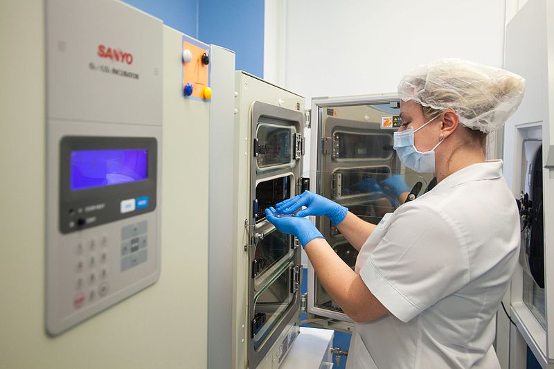 Women operating machinery at a fertility clinic