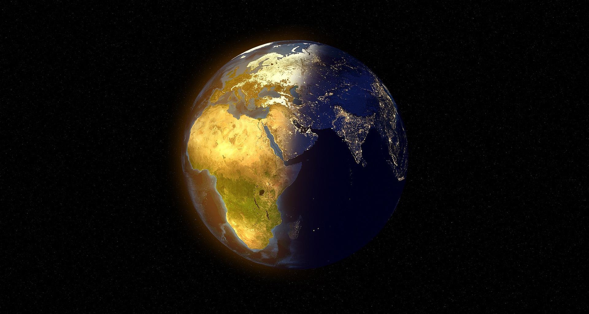 The Earth in orbit, with one side illuminated by the sun, and the other side in darkness.